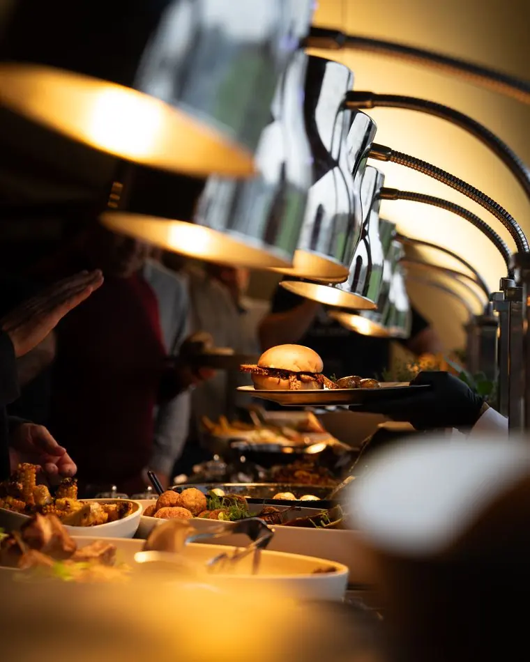 Event catering with golden heat lamps